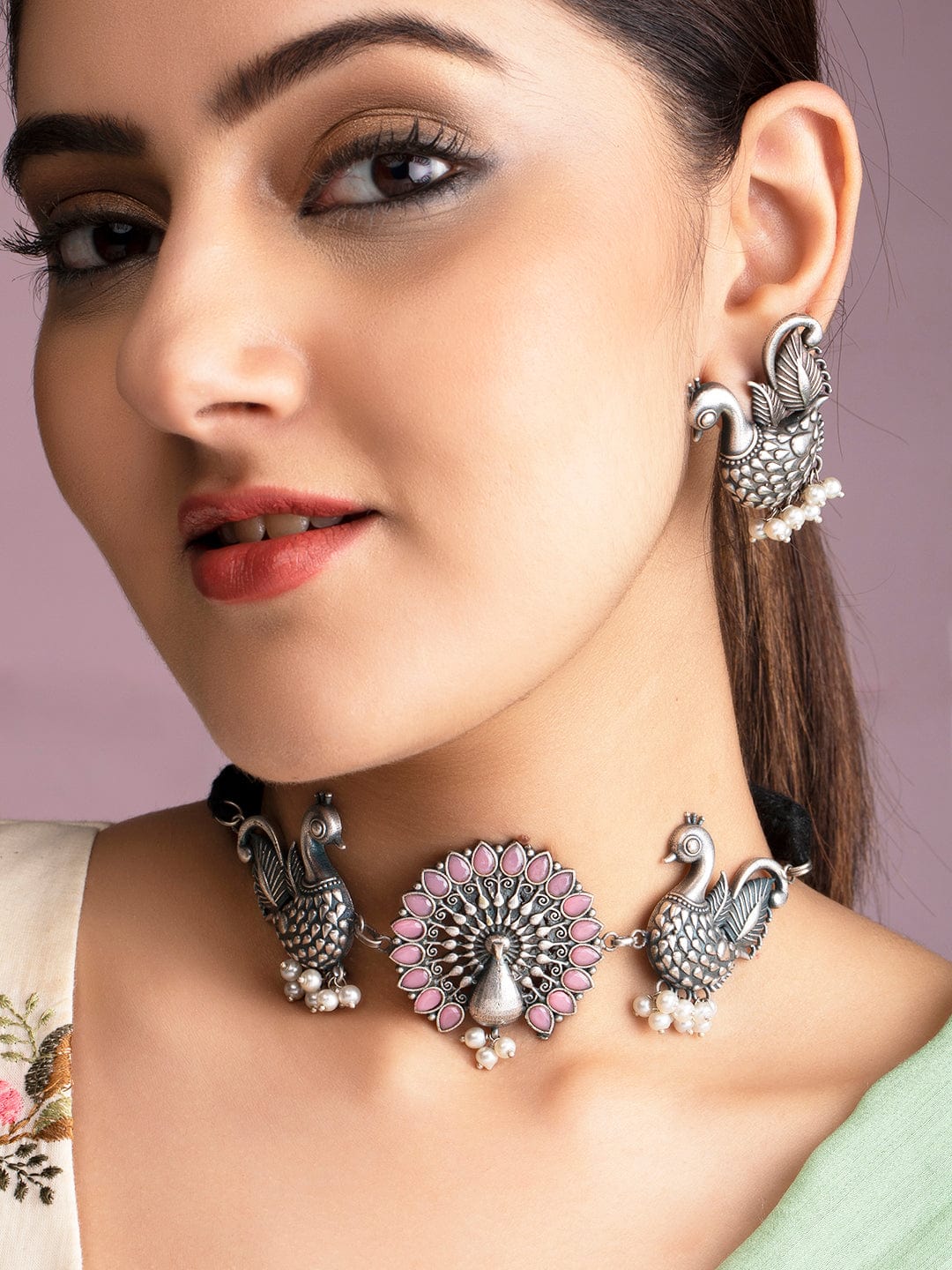 Rubans Oxidised Silver Handcrafted Ruby Studded Peacock Necklace Set.