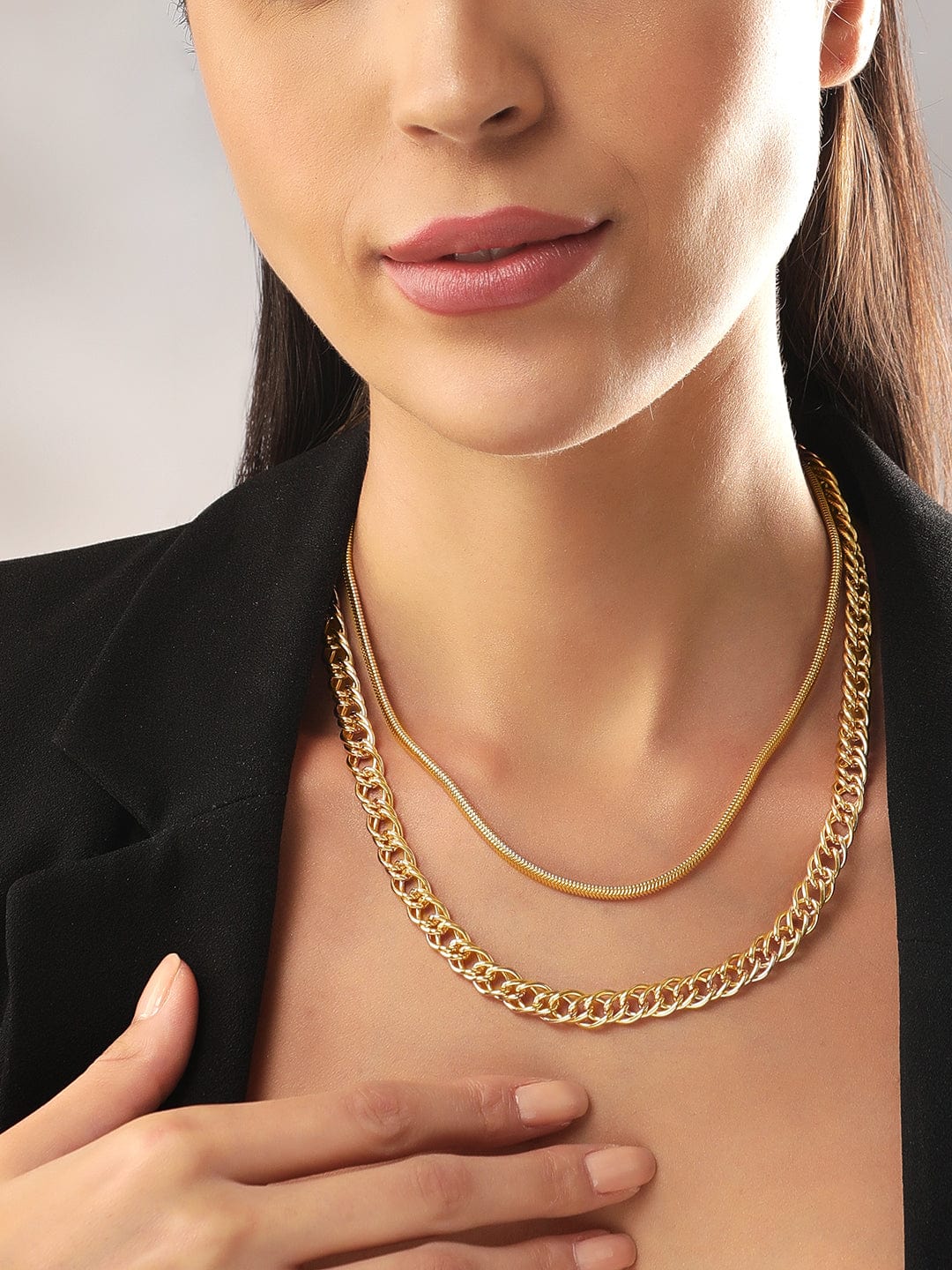 http://rubans.in/cdn/shop/products/rubans-voguish-gold-plated-cuban-chain-double-layered-chain-chain-necklaces-33579493195950.jpg?v=1678267711