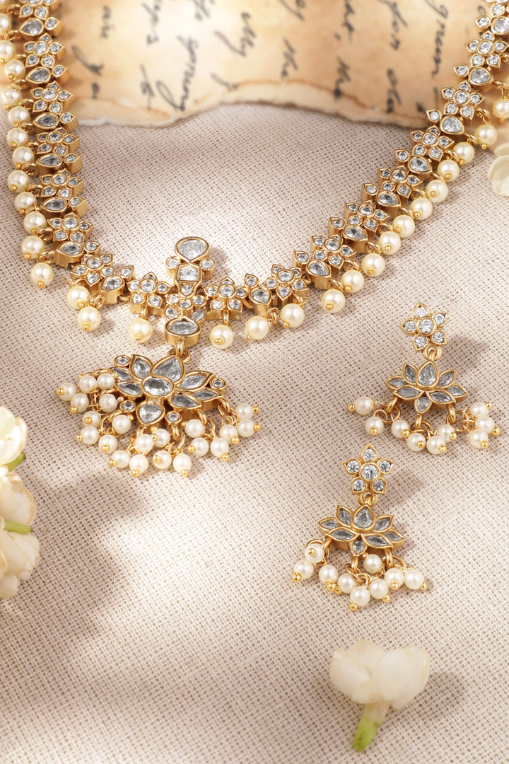 22K Gold plated Polki Zirconia studded Floral motif Pearl beaded Sleek Necklace Set Jewellery Sets