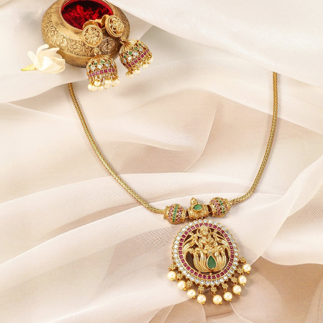 22K Gold-Plated Ruby, Emerald & CZ Studded Laxmi Temple Necklace Set with Pearl Drop Necklace Set