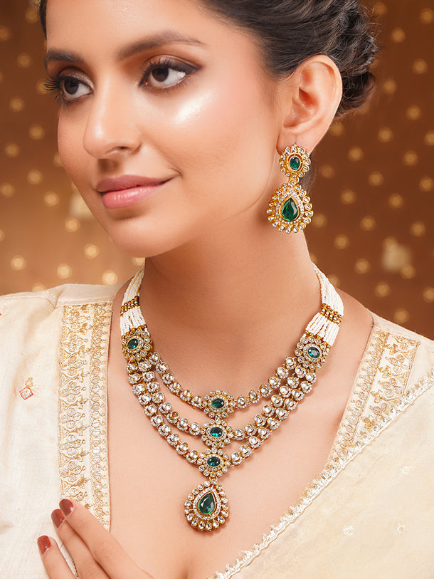 Gold Plated Pearl Beaded Emerald Green Kundan Layered Necklace Set With Maang Tikka