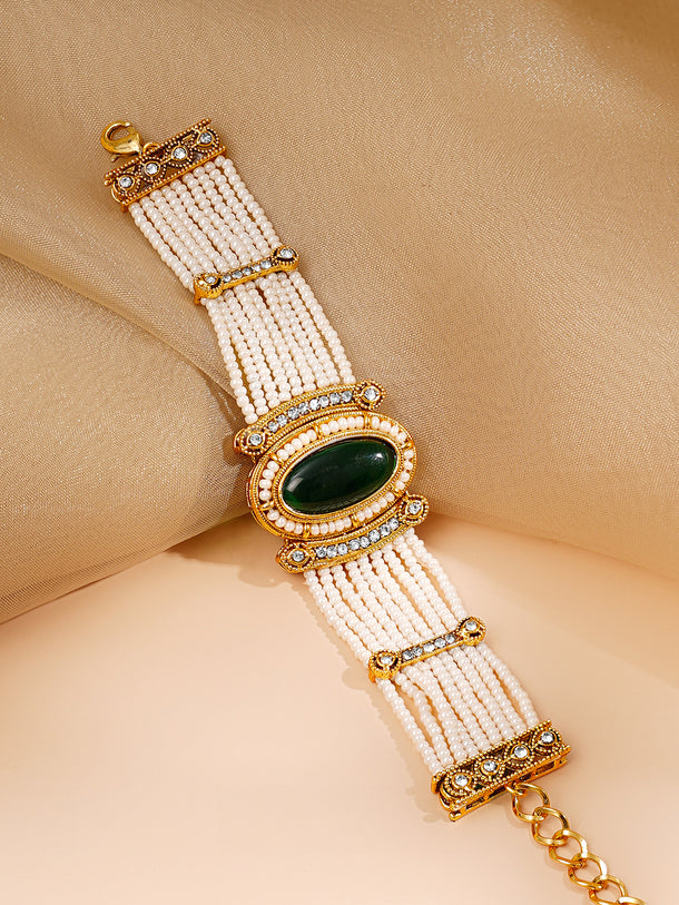 Gold Plated Pearl Beaded Multi Strand Kundan Emerald Centered Bracelet