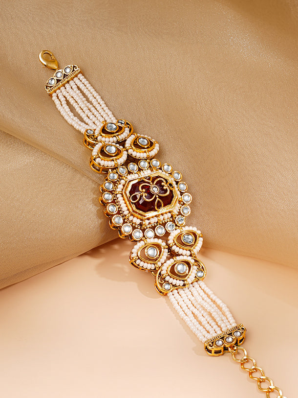 Gold Plated Pearl Beaded Multi Strand Kundan Ruby Centered Bracelet