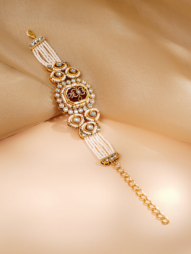 Gold Plated Pearl Beaded Multi Strand Kundan Ruby Centered Bracelet
