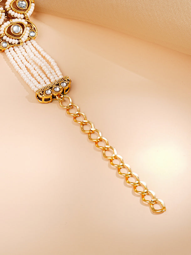 Gold Plated Pearl Beaded Multi Strand Kundan Ruby Centered Bracelet