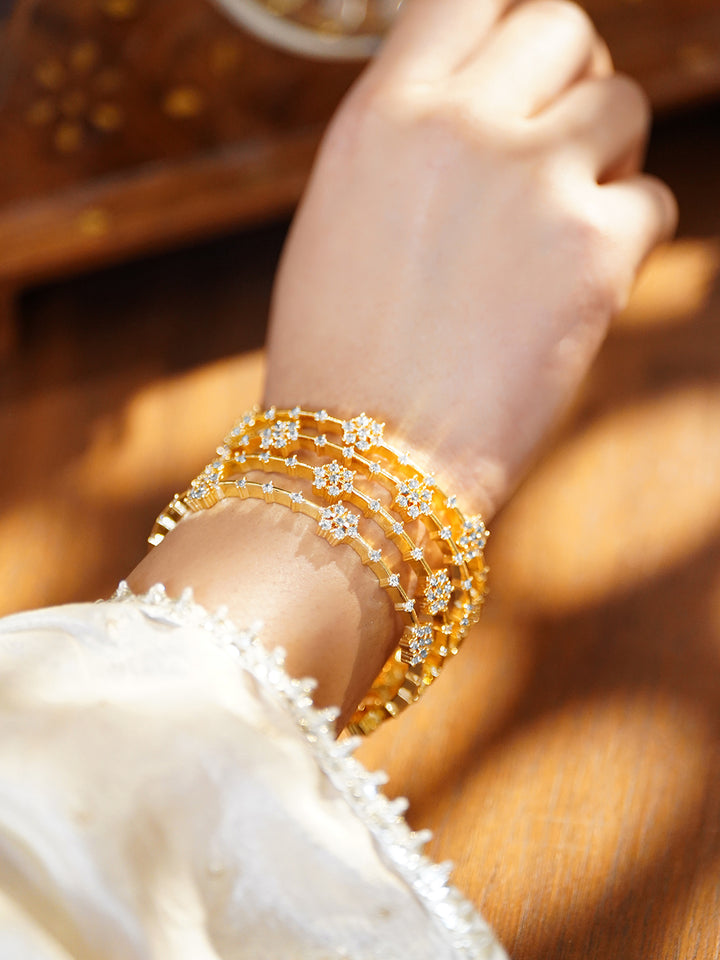 Rubans Set of 4 18K Gold-Plated Brass Floral Cubic Zirconia Bangles