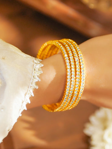 Gold Toned White Studded Bangles Set Of 4