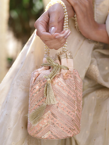Rubans Peach Pink Sequin Embellished Potli Bag with Pearl Handle & Golden Beaded Tassel Detailing