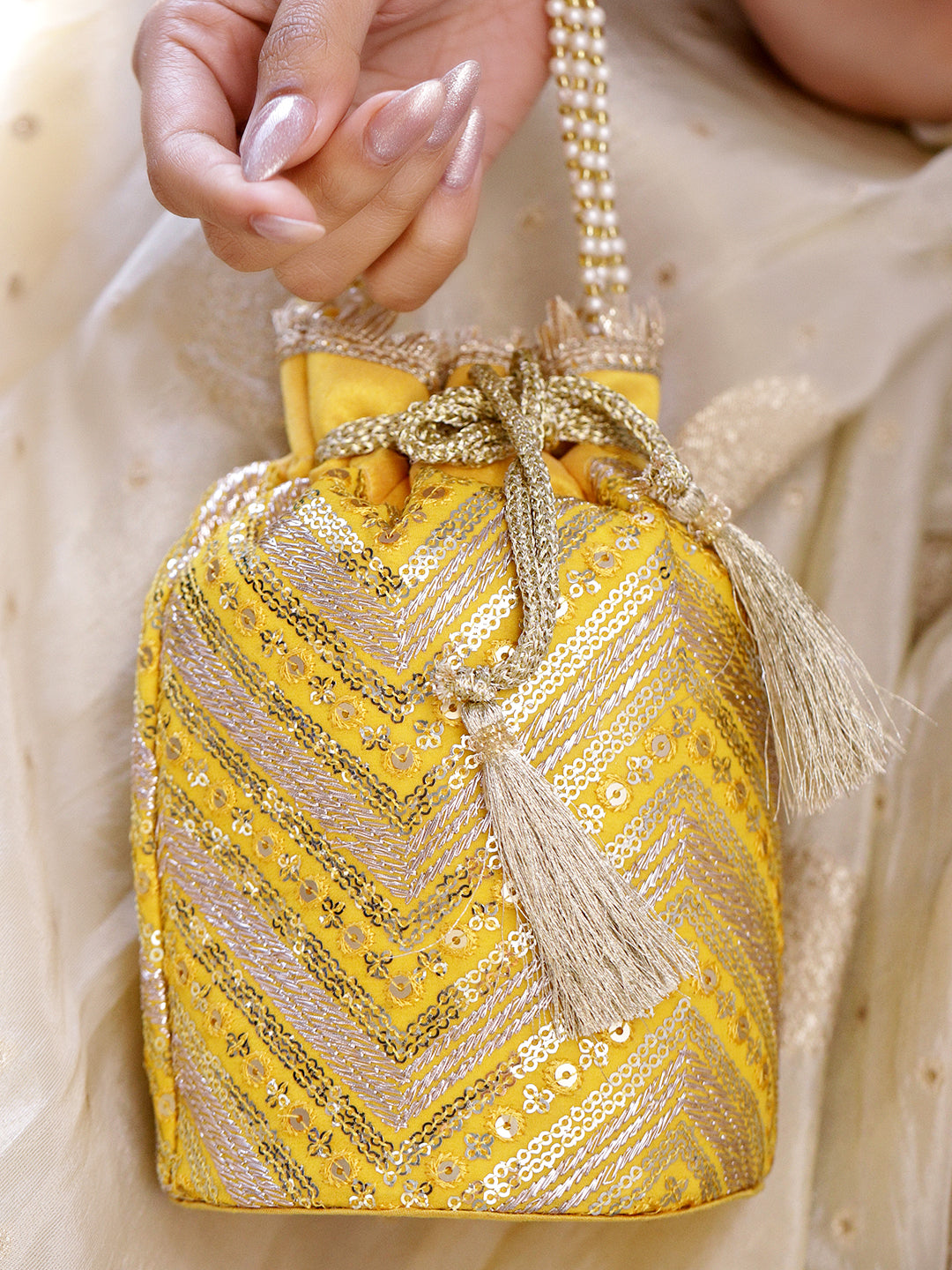Rubans Bright Yellow Sequin Embroidered Festive Potli Bag with Pearl Handle & Golden Beaded Tassels