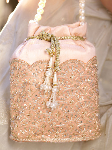 Women Peach Fabric Potli Bag with Golden Embroidery, White Stones & Pearl Tassel Handle