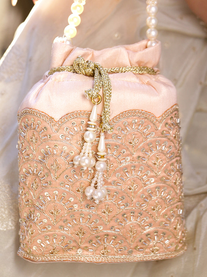 Women Peach Fabric Potli Bag with Golden Embroidery, White Stones & Pearl Tassel Handle