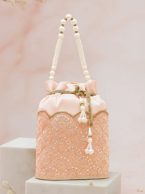 Women Peach Fabric Potli Bag with Golden Embroidery, White Stones & Pearl Tassel Handle
