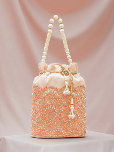 Women Peach Fabric Potli Bag with Golden Embroidery, White Stones & Pearl Tassel Handle