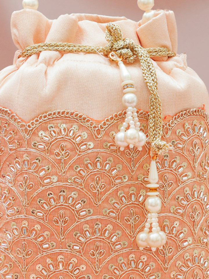 Women Peach Fabric Potli Bag with Golden Embroidery, White Stones & Pearl Tassel Handle