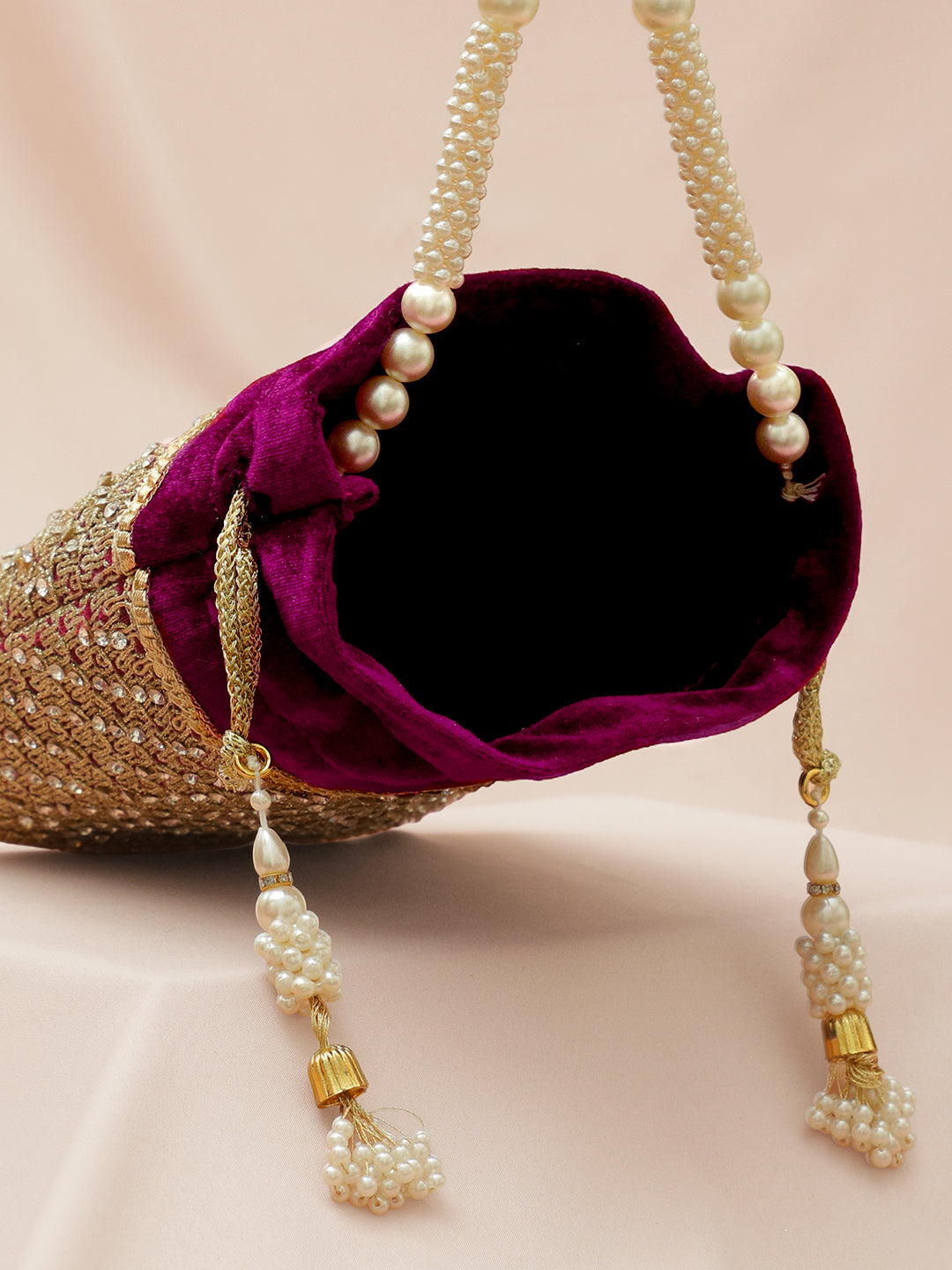 Rubans Purple Velvet Potli Bag with Pearl Handle, Golden Embroidery & Stone Detailing