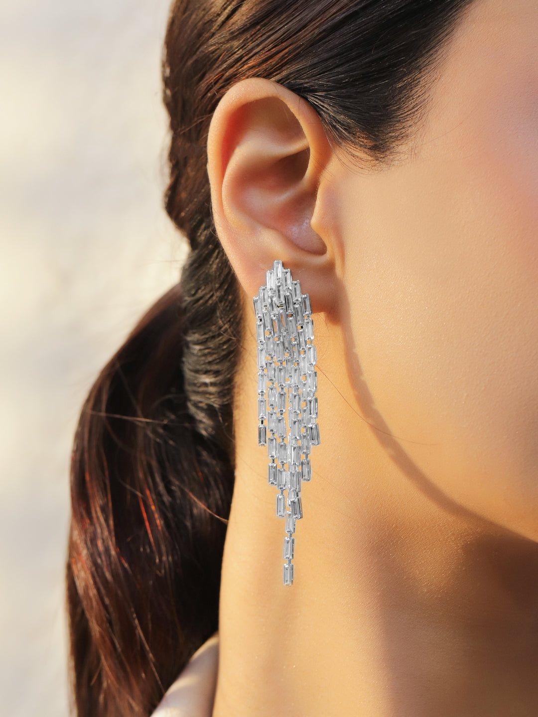 Rubans Voguish Rhodium-Plated Crystal White Baguette Feather Drop Danglers Earrings