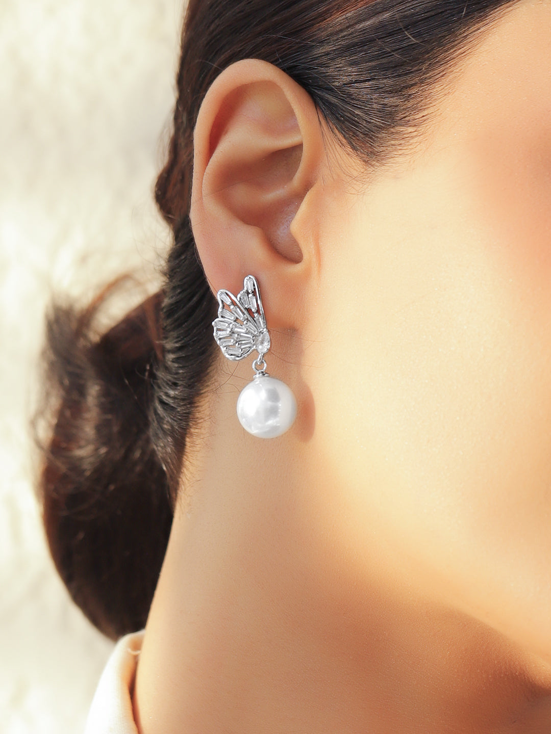 Rubans Voguish Rhodium-Plated Butterfly Wing Crystal AD Stud and White Pearl Drop Earrings