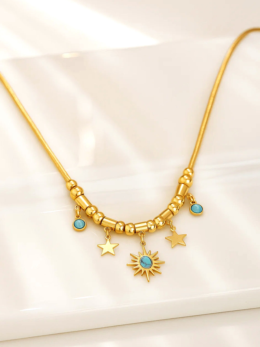 Rubans 22K Gold-Plated Brass Statement Charm Necklace with Sun, Star & Turquoise Blue Beads