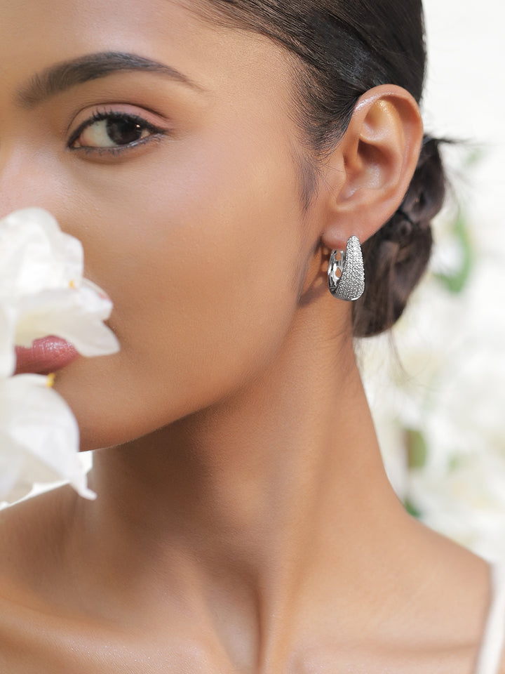 Rubans Rhodium-Plated Cubic Zirconia Studded Oval Shaped Hoop Earrings