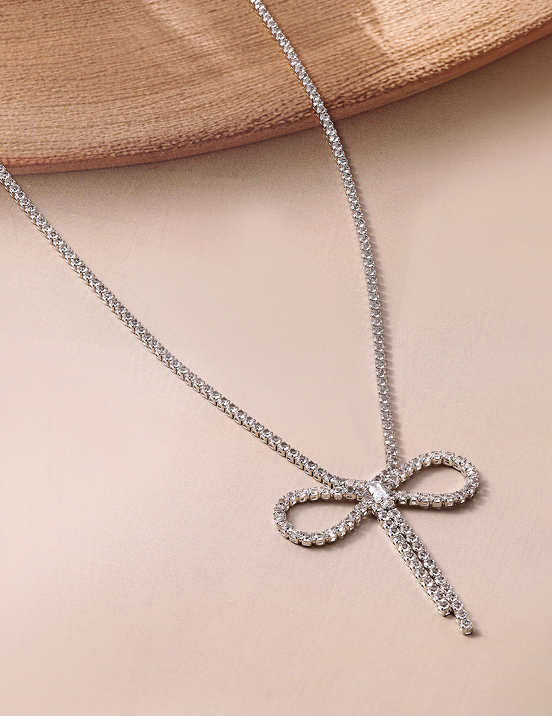 Rubans Rhodium Plated AD & Cubic Zirconia Studded Bow Design Statement Necklace