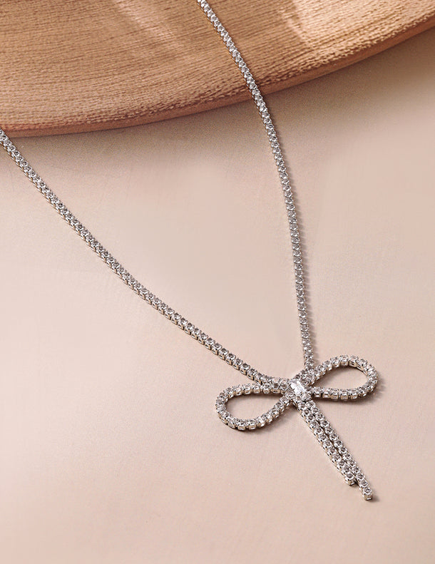 Rubans Rhodium Plated AD & Cubic Zirconia Studded Bow Design Statement Necklace