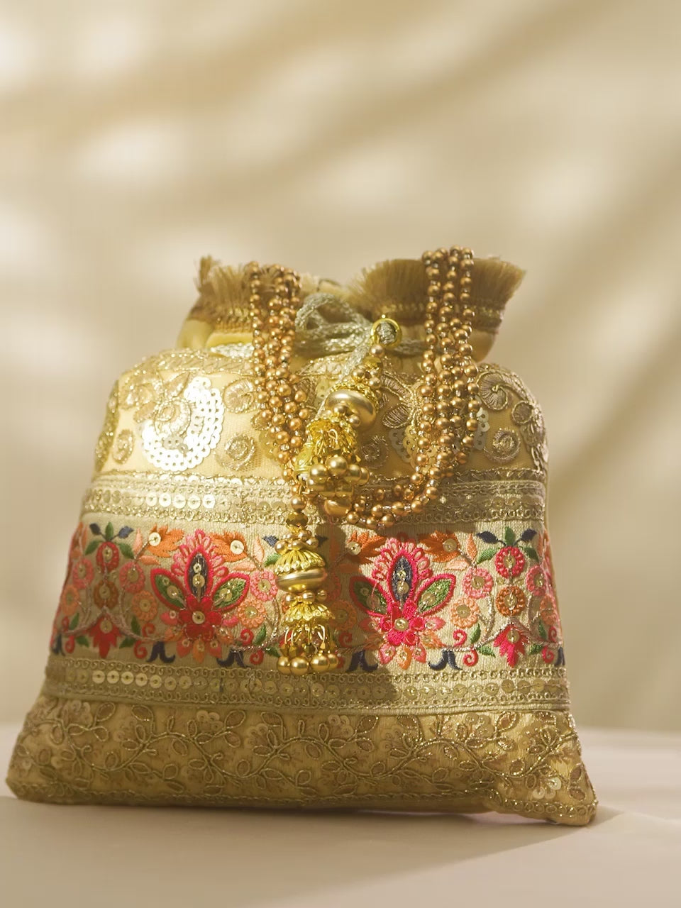 Rubans Gold Coloured Potli Bag With Multicoloured Embroidery