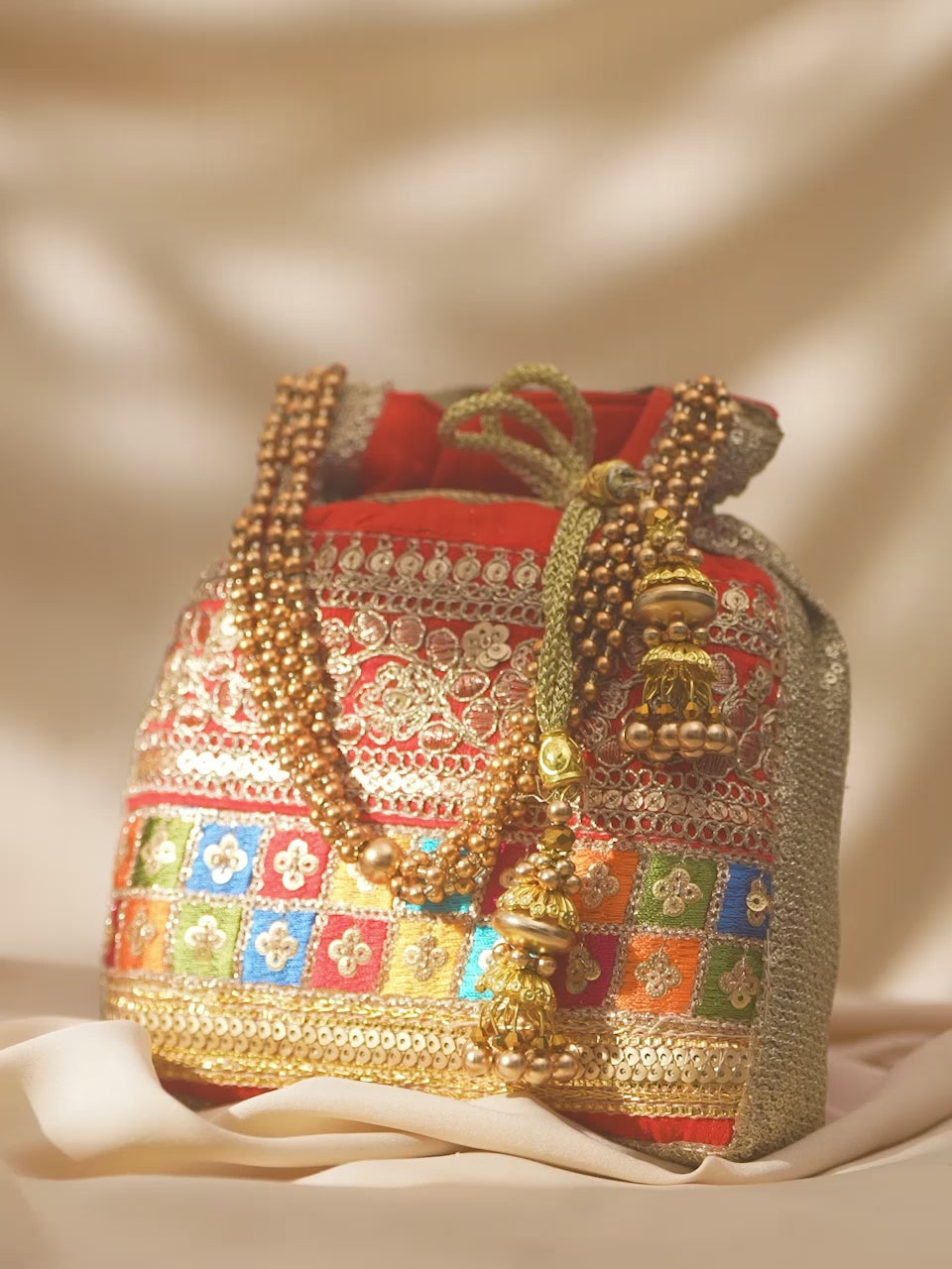 Rubans Red Coloured Potli Bag With Multicoloured Embroidery Design