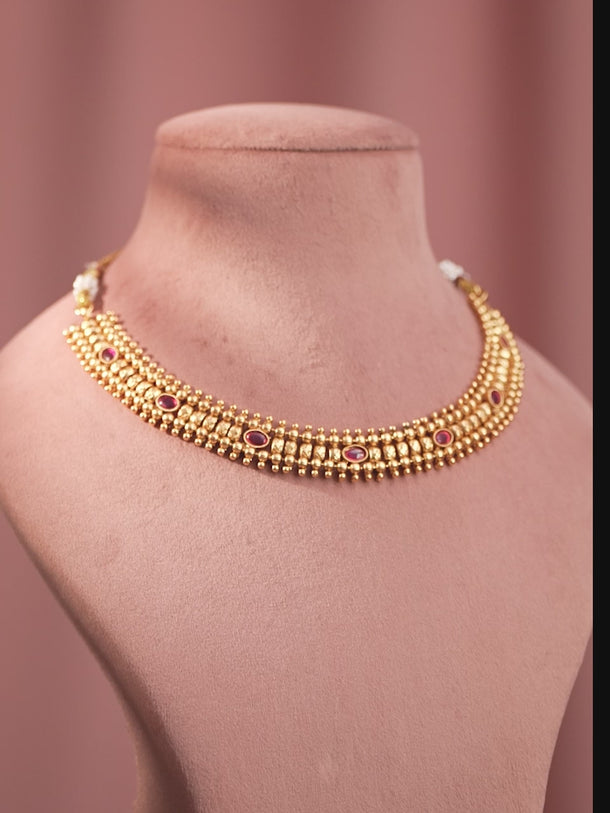 Ruby Studded Golden Necklace Set