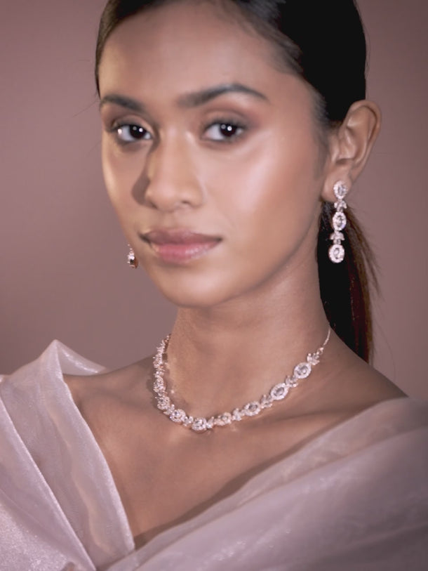 Rubans Simple Gold Toned CZ Necklace Set with Long Earrings