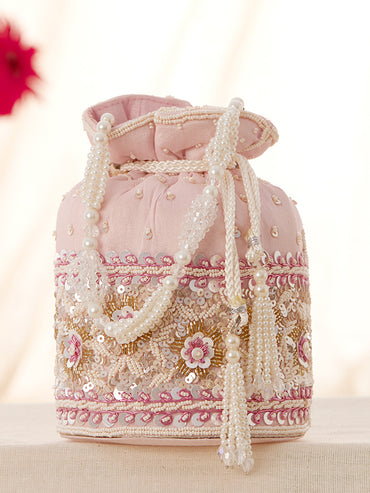 Rubans Pink Coloured Potli Bag With Golden And White Embroided Design.