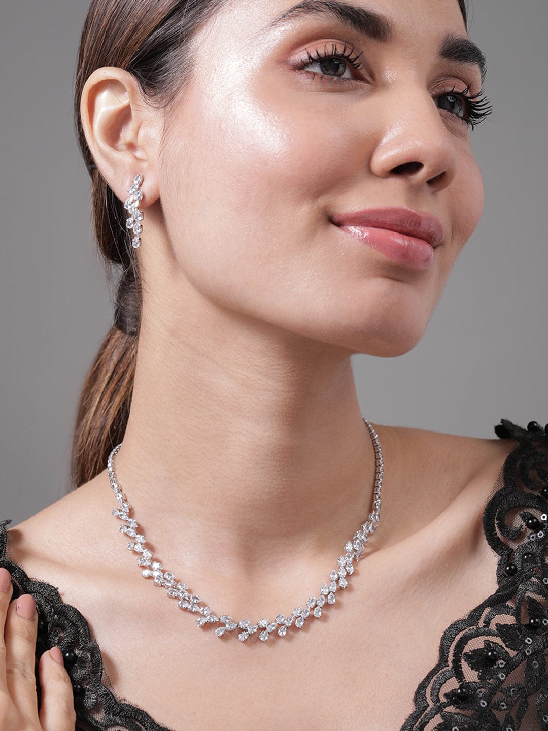 Rhodium Plated AD & Cubic Zirconia Studded Luxurious Floral Motif Necklace Set Necklace and Earrings