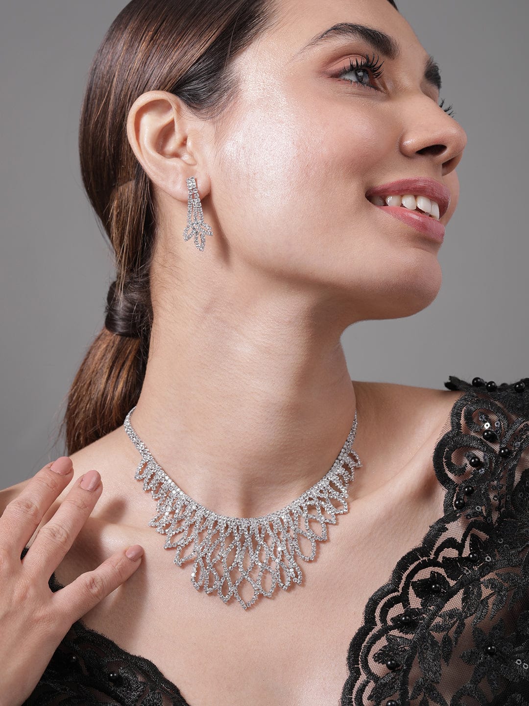 Rhodium Plated AD & Cubic Zirconia Studded Luxurious Leaf Motif Necklace Set Necklace and Earrings