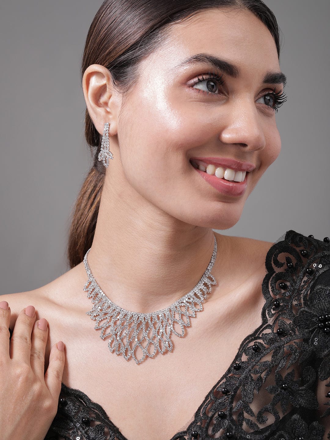 Rhodium Plated AD & Cubic Zirconia Studded Luxurious Leaf Motif Necklace Set Necklace and Earrings