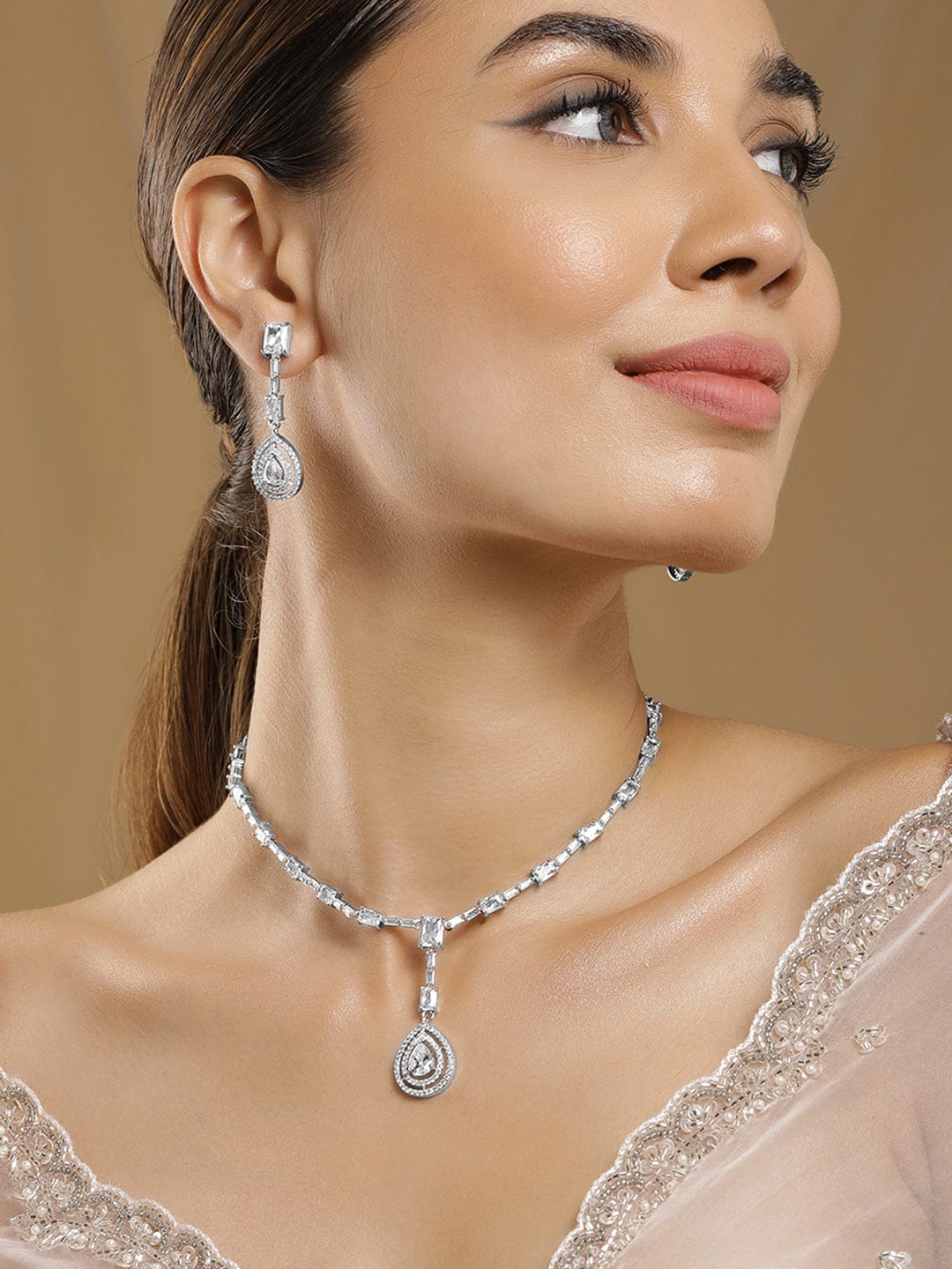 Rhodium Plated AD & Cubic Zirconia Studded Necklace Set with Teardrop Pendants Pendant and Earrings