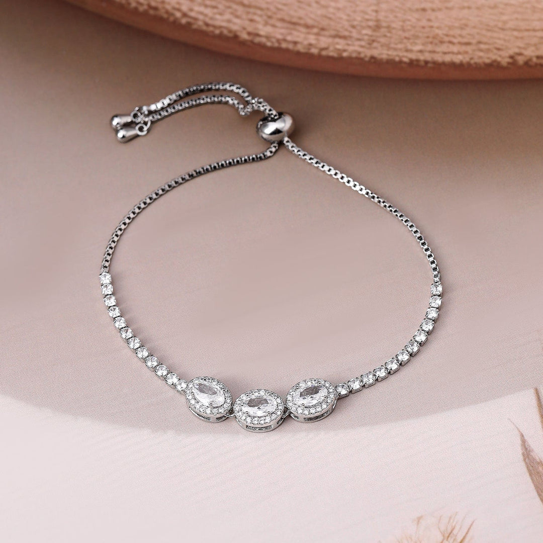 Rhodium Plated AD & Cubic Zirconia Studded Triple Oval Charm Bracelet Bracelet