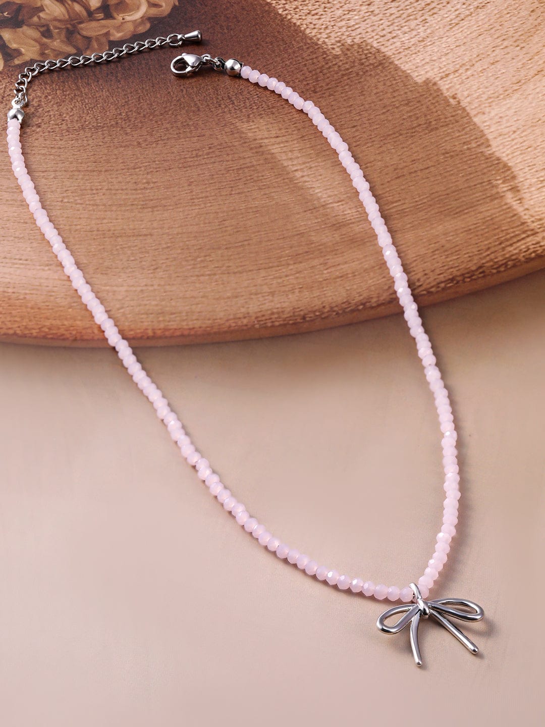 Rhodium Plated Soft Pink Beaded Necklace with Silver Bow Pendant Necklace and Chains