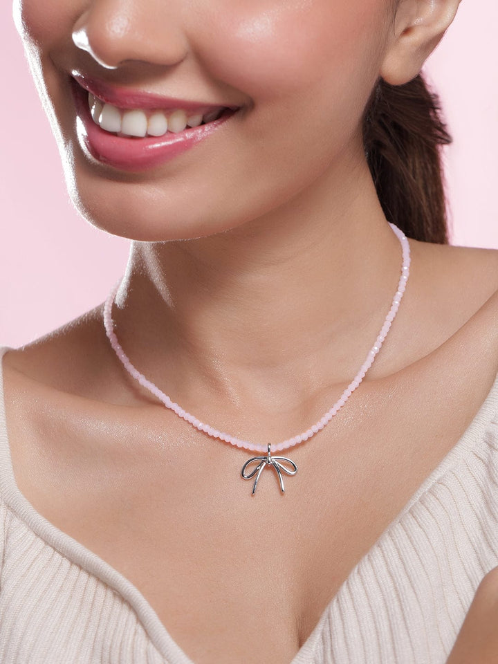 Rhodium Plated Soft Pink Beaded Necklace with Silver Bow Pendant Necklace and Chains