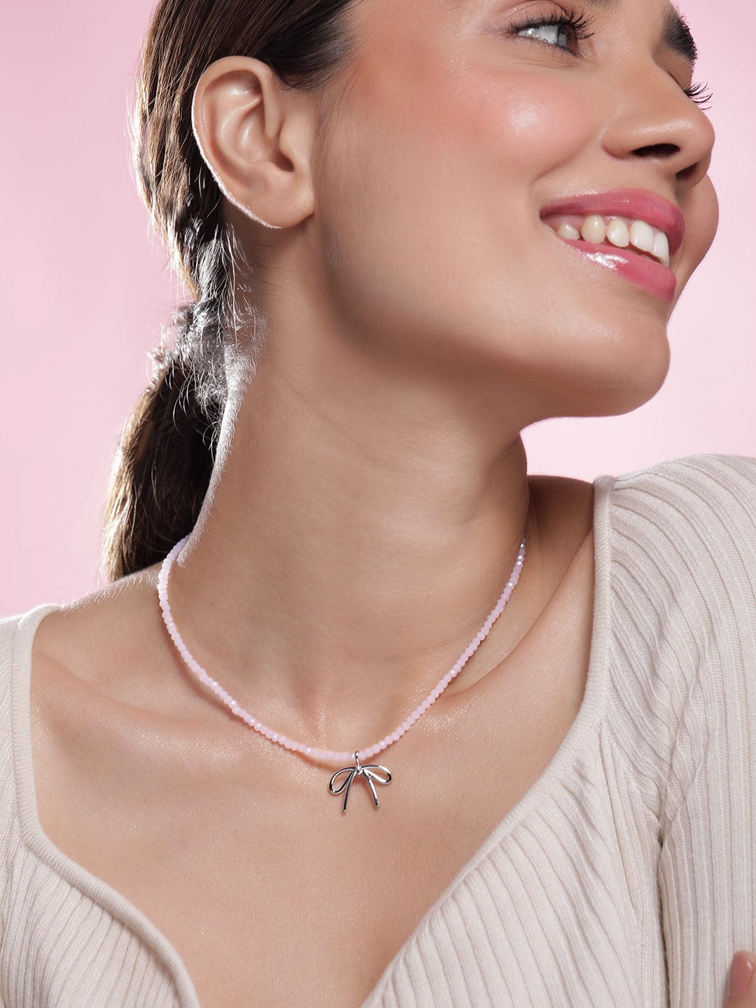 Rhodium Plated Soft Pink Beaded Necklace with Silver Bow Pendant Necklace and Chains