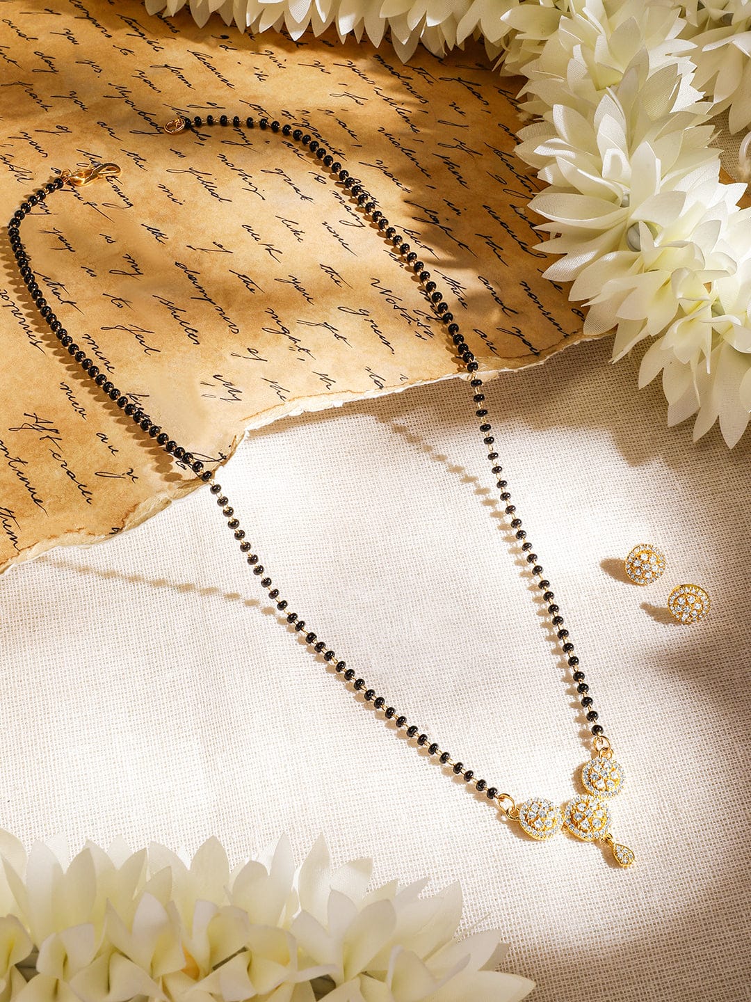 Rubans 18K Gold-Plated White Cubic Zirconia Studded Circular Pendant Mangalsutra Set with Black Beads Chain & Earrings Mangalsutra