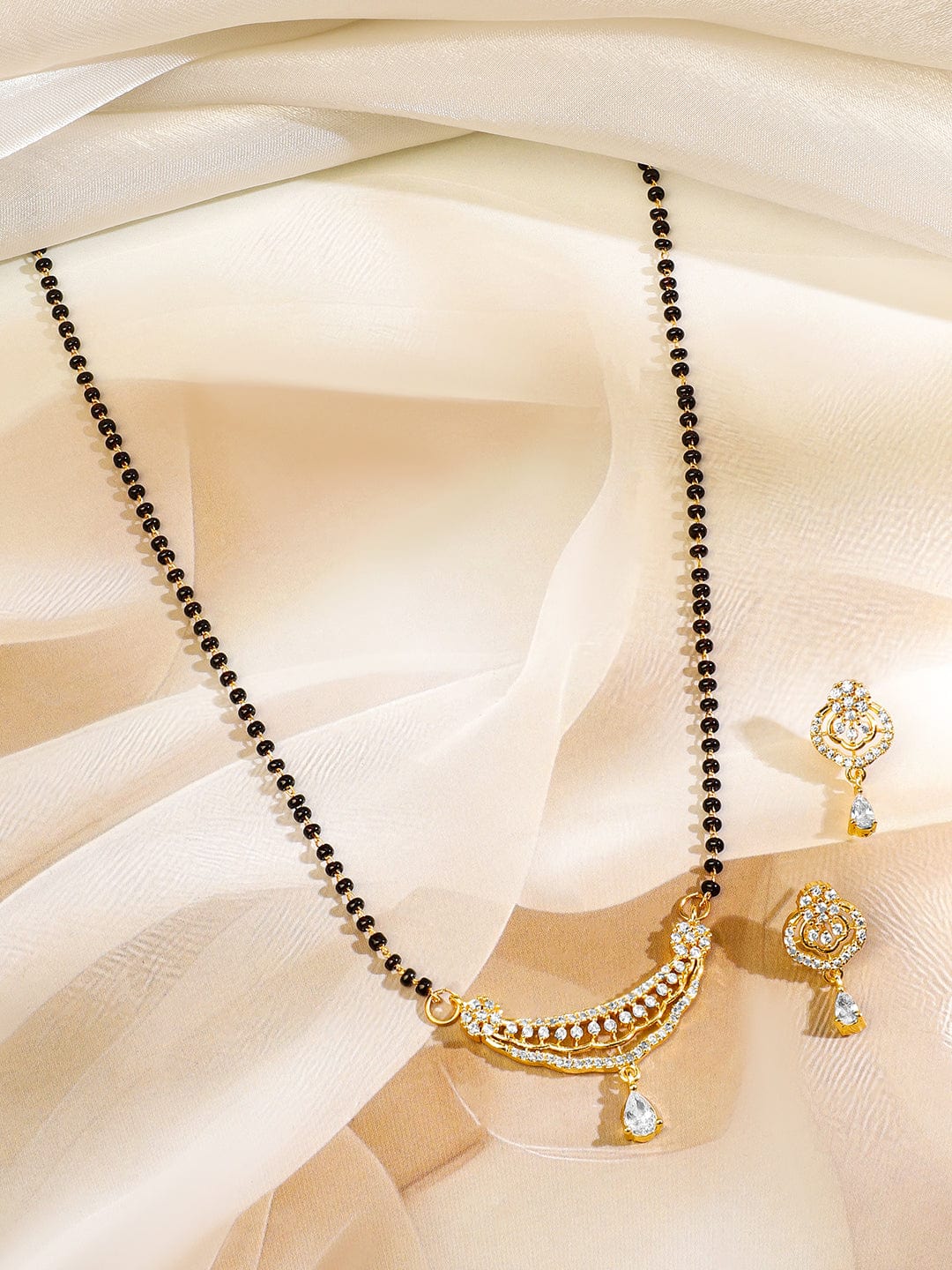 Rubans 18K Gold-Plated White Cubic Zirconia Studded Curved Bar Mangalsutra Set with Black Beaded Chain & Earrings Mangalsutra Set