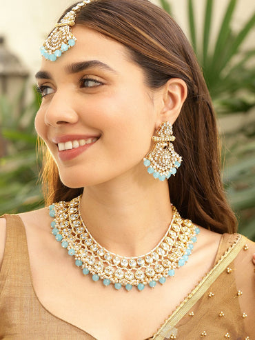 Rubans 22K Gold-Plated White Kundan Studded & White Pearls & Blue Bead Drops Handcrafted Bridal Necklace Set Necklaces, Necklace Sets, Chains & Mangalsutra