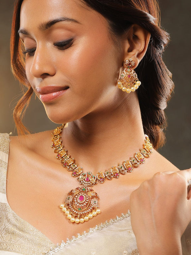 Rubans 24K Gold-Plated Medium-Length Lakshmi Motif Temple Jewellery Set with Ruby Pink, Emerald Green, White Cubic Zirconia & Pearl Beads for Women Jewellery Set