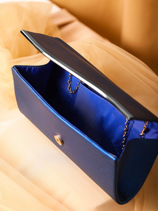 Rubans Blue Sapphire Glossy Textured Clutch with Silver-Tone Wavy Accent & Chain Bags