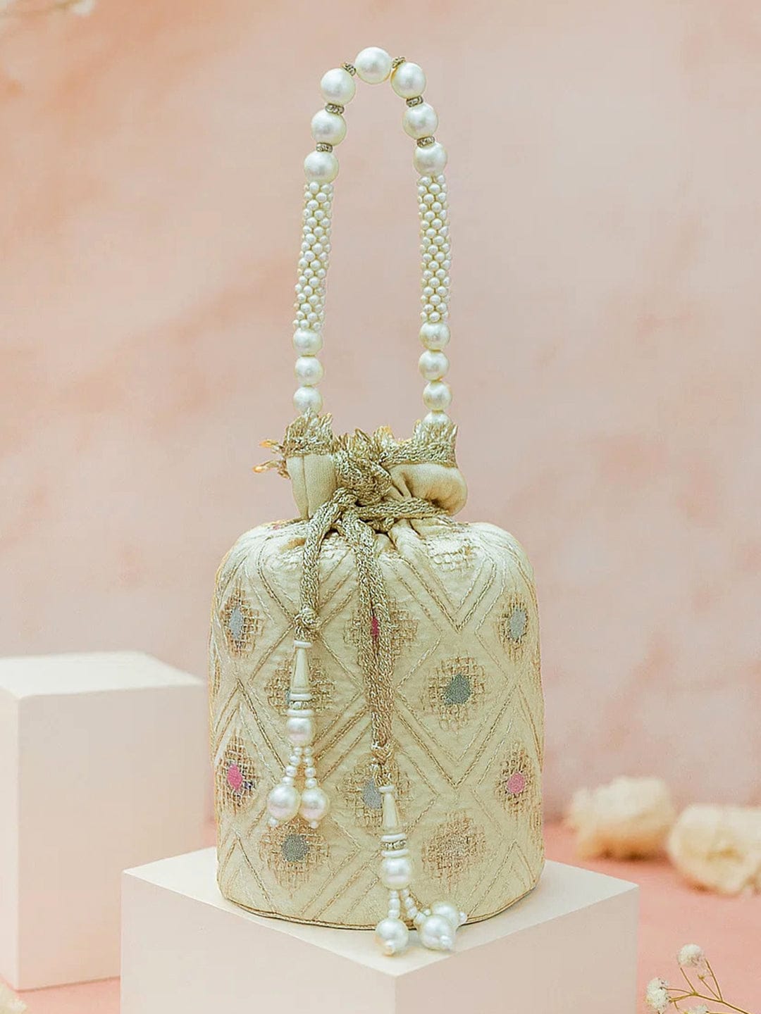 Rubans Cream Potli Bag with Multicolor Pastel Embroidery, Pearl Beaded Handle and Golden Tassel Detailing Bags