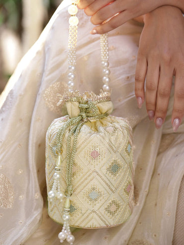 Rubans Cream Potli Bag with Multicolor Pastel Embroidery, Pearl Beaded Handle and Golden Tassel Detailing Bags