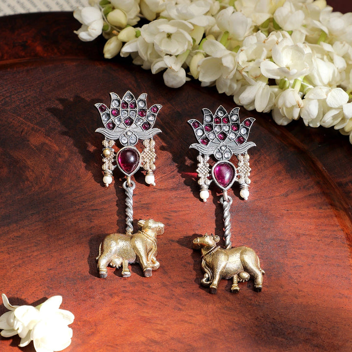 Rubans Dual-Tone Oxidized Lotus Motif Drop Earrings with Pink Stone and Gold Cow Charm Drop Earrings