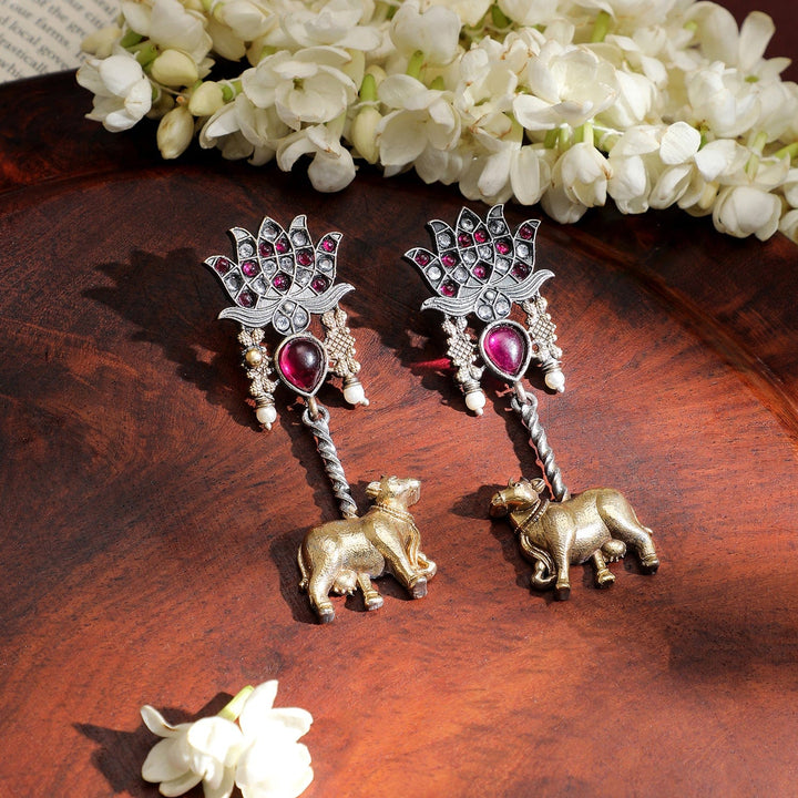 Rubans Dual-Tone Oxidized Lotus Motif Drop Earrings with Pink Stone and Gold Cow Charm Drop Earrings