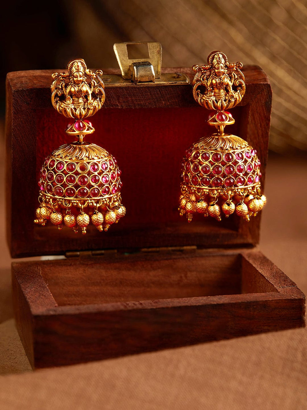 Rubans Gold Plated Handcrafted Devine Lakshmi With Red Stone Earrings Jhumka . Earrings