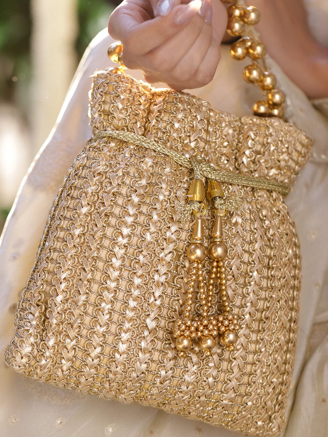 Rubans Gold-Toned Woven Metallic Potli Bag with Golden Bead Handle & Tassel Detailing Bags