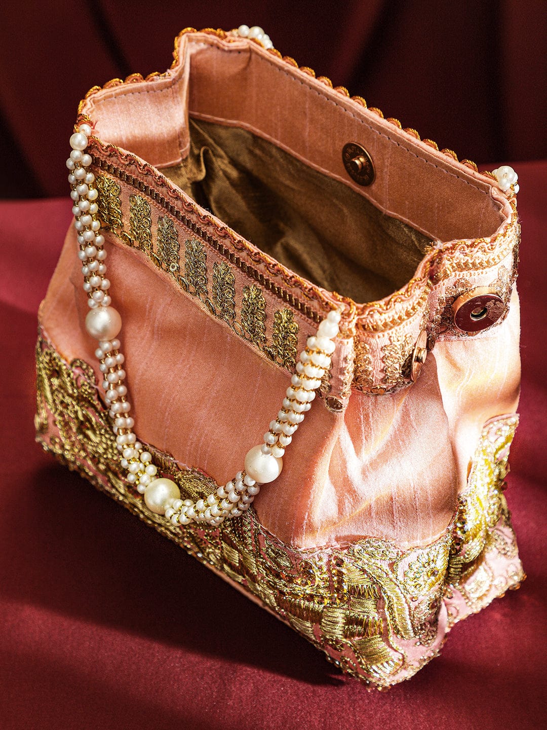 Rubans Handcrafted Peach Pink Silk Potli Bag with Pearl Handle & Gold Embroidered Elephant Motif Bags